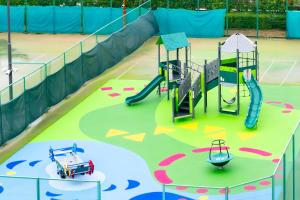 a play area with a slide and a playground at Hotel Okura Kobe in Kobe