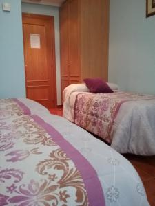 Posteľ alebo postele v izbe v ubytovaní Hostal Campus