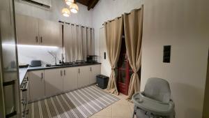 a kitchen with a sink and a toilet in a room at Archontiko Chios Traditional Mansion in Thymianá
