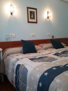 Posteľ alebo postele v izbe v ubytovaní Hostal Campus
