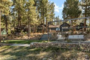 a garden with a bench and a house at Lakefront View Stunner in Big Bear Lake