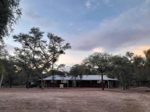 a building with a truck parked in front of it at Posada doña ilene in Quimilí