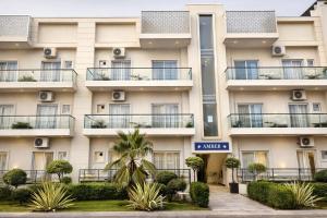 an apartment building with balconies and plants at The Amber Signature Vrindavan # A Luxury Apartment With #Lift# Garden # Parking# Ac Rooms# & Elegant interior # Located Inside- Omaxe Eternity Vrindavan in Vrindāvan