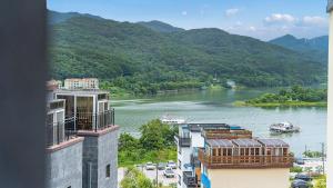 a view of a river with mountains in the background at Gapyeong Ciere Poolvilla in Gapyeong