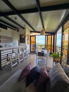 a living room with a couch and a table at Chalet - ENCANTO - Donde la Tranquilidad tiene la mejor Vista in El Cerrito +48 photos