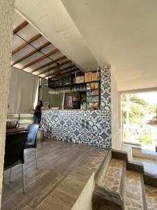a dining room with a counter and a window at Casa blue in Rodadero
