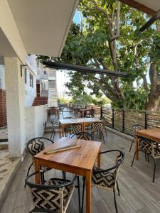 a group of tables and chairs on a patio at Casa blue in Rodadero
