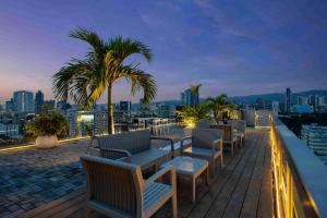 a row of chairs on the roof of a building at Citi Park Hotel Cebu powered by Cocotel in Cebu City