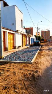 a cobblestone street in front of a building at Departamentos Cerro Azul P1 in Cerro Azul +5 photos