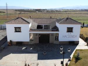 an overhead view of a white house with a garage at La Hacienda del Marquesado in Albuñán