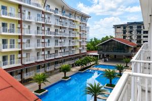 an aerial view of a hotel with a swimming pool at 2 Mins Away from Mactan Cebu Airport in Pusok