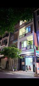 a building with a tree in front of it at 846 A12 Bùi Thiện Ngộ in Cù Lao Tâu
