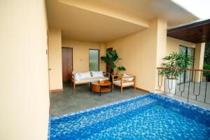 a view of a swimming pool in a house at MAHALAYA Garden Resort in Pablengan