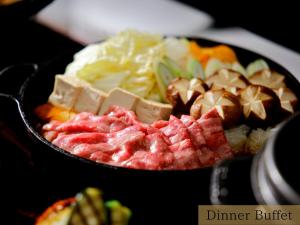 a bowl of food with meat and other vegetables at The HOTEL SANRAKU KANAZAWA in Kanazawa +104 photos