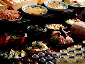 a buffet of different types of food on a table at The HOTEL SANRAKU KANAZAWA in Kanazawa