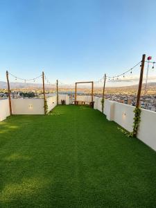 a view from the roof of a house with green grass at Libertad Grand Hotel in Ayacucho