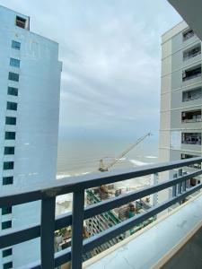 a view of the beach from the balcony of a building at Da nang seaview MT apartment in Danang