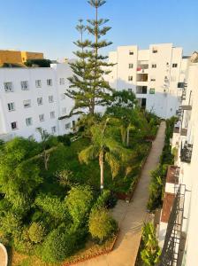 an aerial view of a garden with trees and buildings at Perfect home in Temara