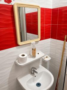 a bathroom with a sink and a mirror at Perfect home in Temara +3 photos