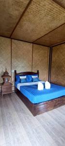 a bedroom with a bed in a tent at ปายเรือนไทย in Pai