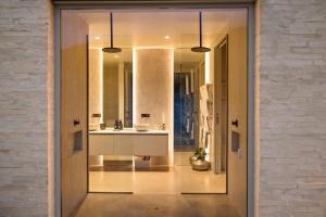 a bathroom with a sink and a mirror at Pavilion-Style Residence Queenstown in Queenstown