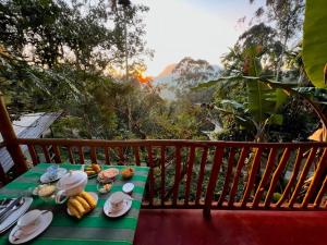 a table with plates of food on a balcony at Green View Resort in Ella +18 photos