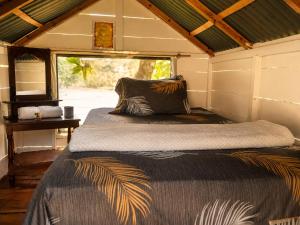 a bedroom with a bed in a small room at Ecohotel El Amarradero in Alejandría +66 photos