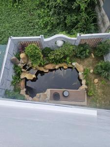 a model of a garden with a small pond at Home Phong Vân in Hâu Thon
