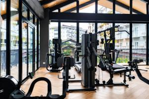 a gym with several treadmills and elliptical machines at 2 Mins Away from Mactan Cebu Airport in Pusok