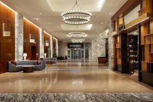 a lobby of a hotel with couches and a chandelier at Grand Hyatt San Antonio River Walk in San Antonio +112 photos