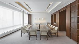 a large conference room with a long table and chairs at Andaz Delhi, by Hyatt in New Delhi +89 photos