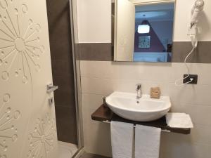 a bathroom with a sink and a shower at B&B Le Scalette B&B San Marco in Abbadia San Salvatore +45 photos