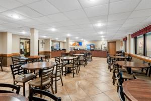a dining room with tables and chairs at Comfort Inn & Suites Branson Meadows in Branson