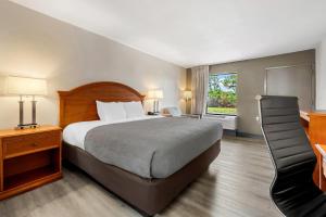 a hotel room with a bed and a window at Quality Inn Battleboro - Rocky Mount in Battleboro +29 photos