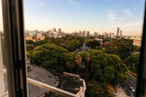 a view of a city from a window at Esplendor Plaza Francia in Buenos Aires