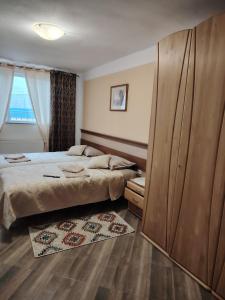 a bedroom with two beds and a large closet at Casa Alma in Paşcani