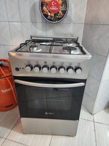 a stove top oven sitting in a kitchen at Rippon Nest in Jinja +6 photos