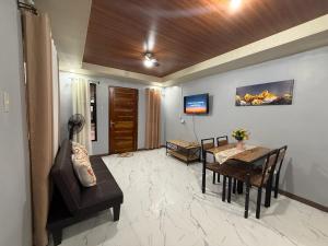 a living room with a table and a dining room at Casa Jawero in Orani
