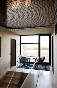 a room with a table and two chairs in it at Meteorite House in Kontiolahti +16 photos
