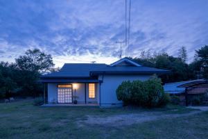a small house with a light in a yard at o ku in Awaji