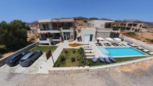 an aerial view of a villa with a swimming pool at Meli apartments Paleochora in Palaiochora