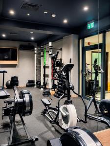 a gym with several exercise bikes in a room at Qubus Hotel Wrocław in Wrocław