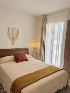 a bedroom with a bed and a window at Villadhara Centro GDL in Guadalajara +245 photos