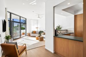 a kitchen and living room with a view of a living room at Coolum Beach Apartment, 2 Bed 2 Bath, Pool in Coolum Beach