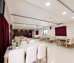 a conference room with a large table and chairs at Hotel Big Boss New Digha in Digha
