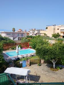 an overhead view of a swimming pool in a city at Alice House 1 in Amarynthos