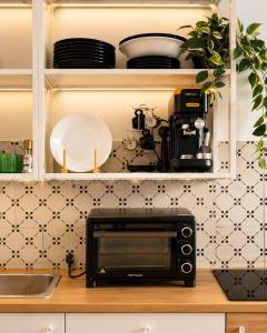 a microwave oven sitting on top of a kitchen counter at Bella Maratea in Maratea