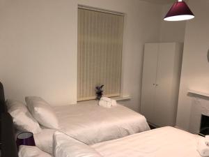 Postel nebo postele na pokoji v ubytování JO Wordsworth Apartment