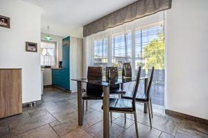 a dining room with a table and chairs at Haus U13 in Röbel