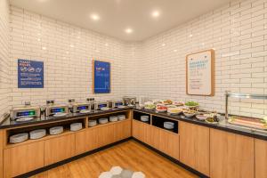a restaurant with a buffet line with food at Holiday Inn Express - Yerevan by IHG in Yerevan